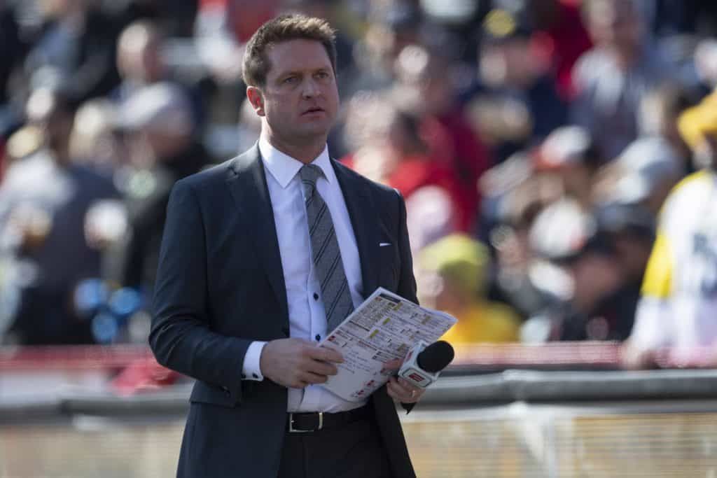 NFL Draft Analyst Todd McShay stands on a football sideline in 2019