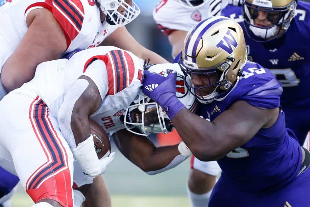 Former University of Washington defensive tackle Levi Onwuzurike making a tackle