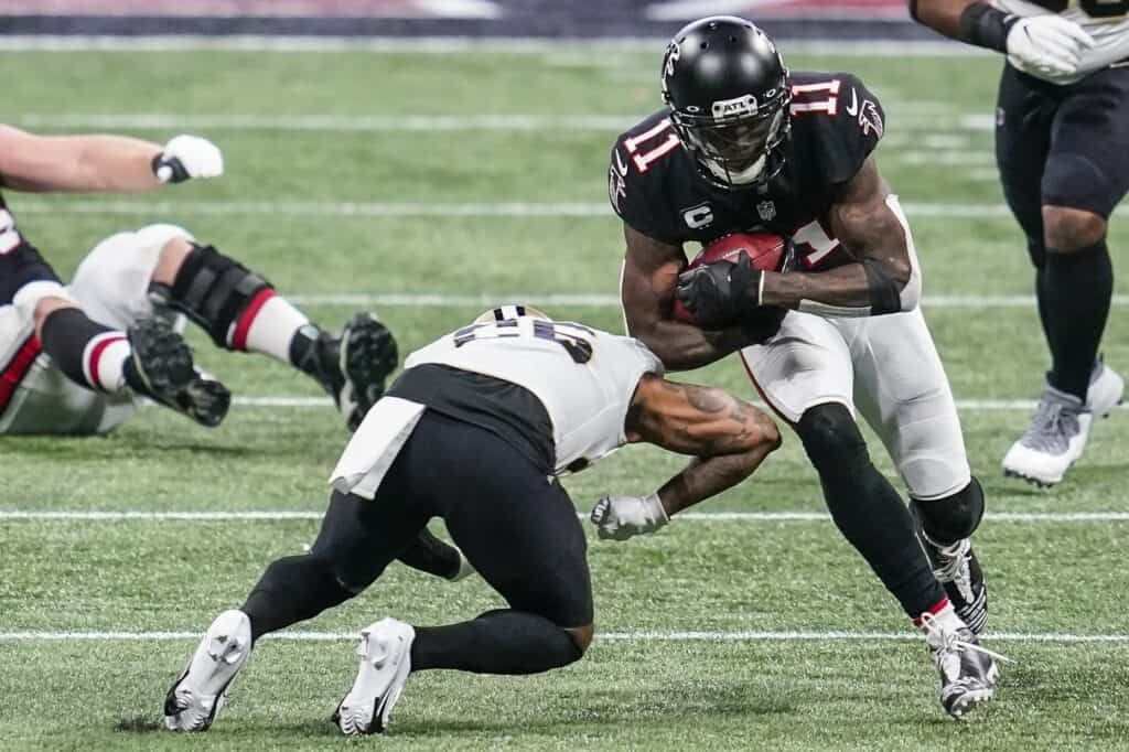 Julio Jones runs through a tackle against the New Orleans Saints