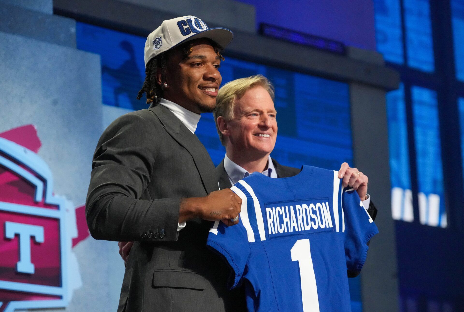 Quarterback Anthony Richardson poses for pictures with NFL Commissioner Roger Goodell at the 2023 NFL Draft.