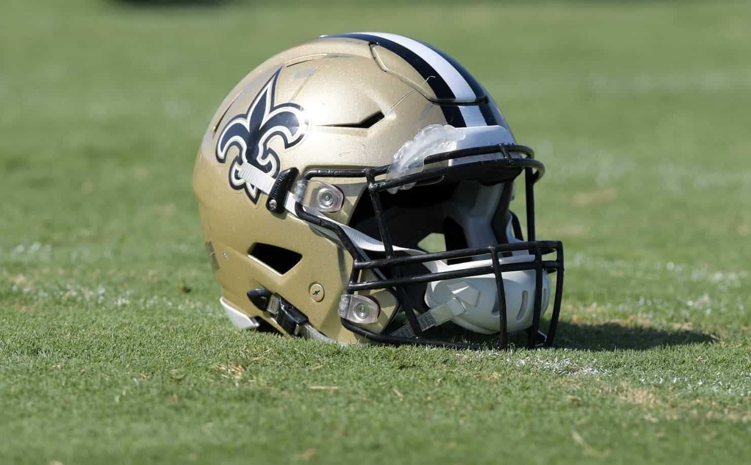 The helmet of the New Orleans Saints on the field.