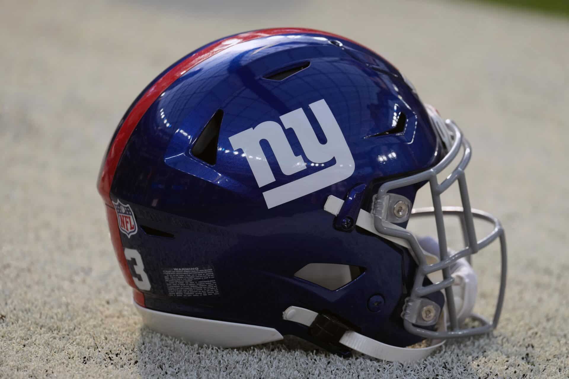 The New York Giants helmet being displayed on the side of the field.