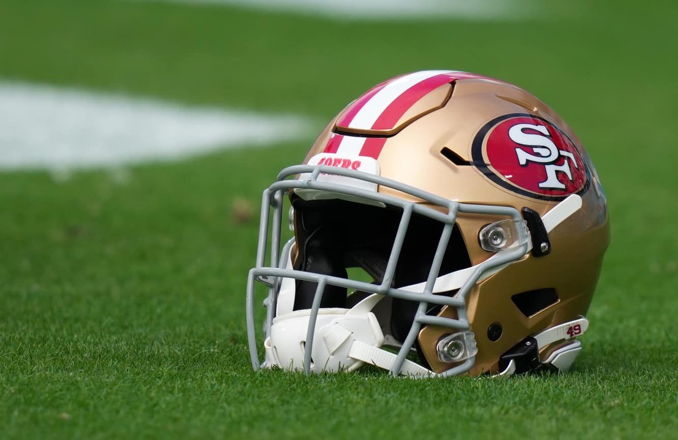 The helmet of the San Francisco 49ers lying on the field.