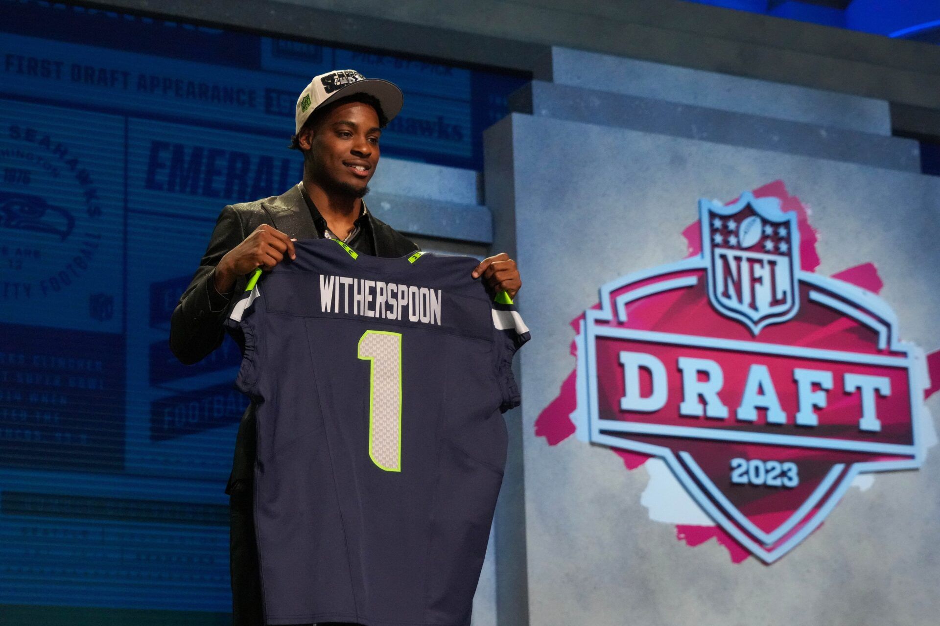 Devon Witherspoon on stage after being selected by the Seattle Seahawks fifth overall in the first round of the 2023 NFL Draft at Union Station.