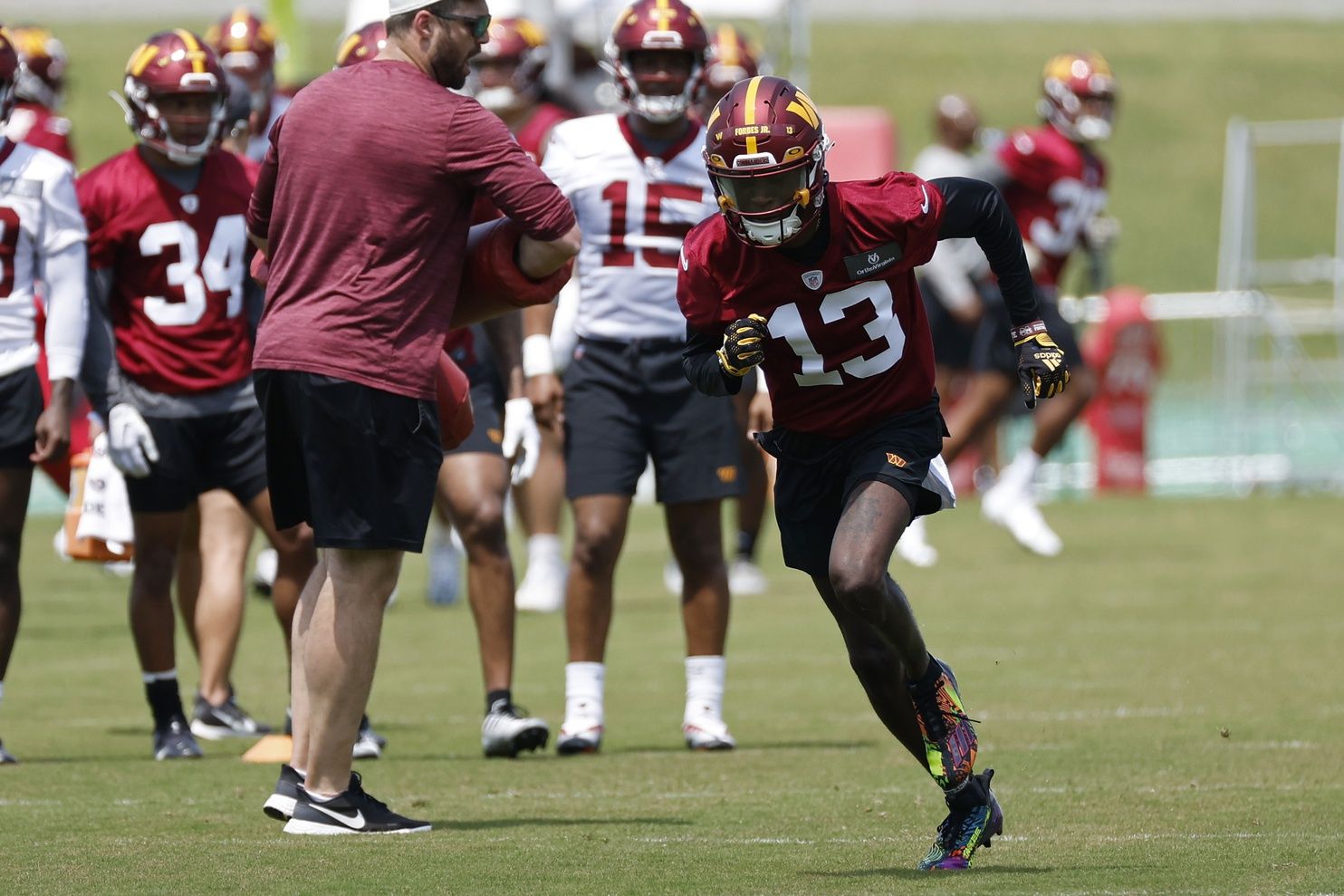 Emmanuel Forbes Jr. (13) participates in drills during Commanders rookie minicamp at Commanders Park.