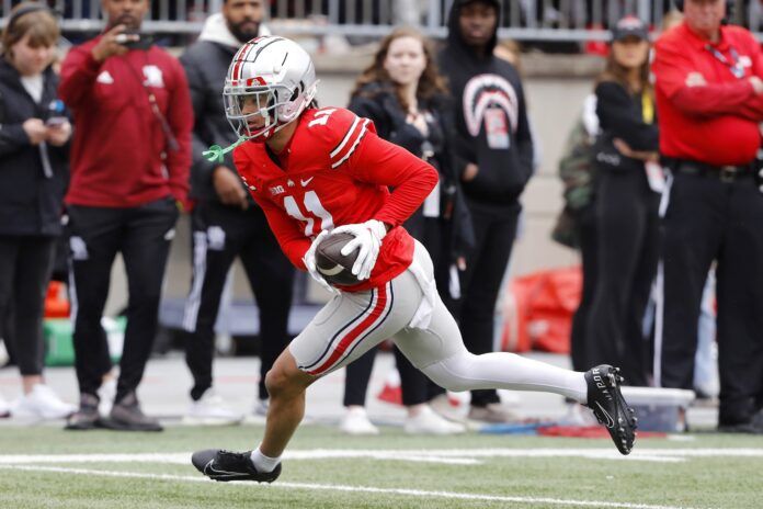 Ohio State WR Jaxon Smith-Njigba (11) runs with the ball.