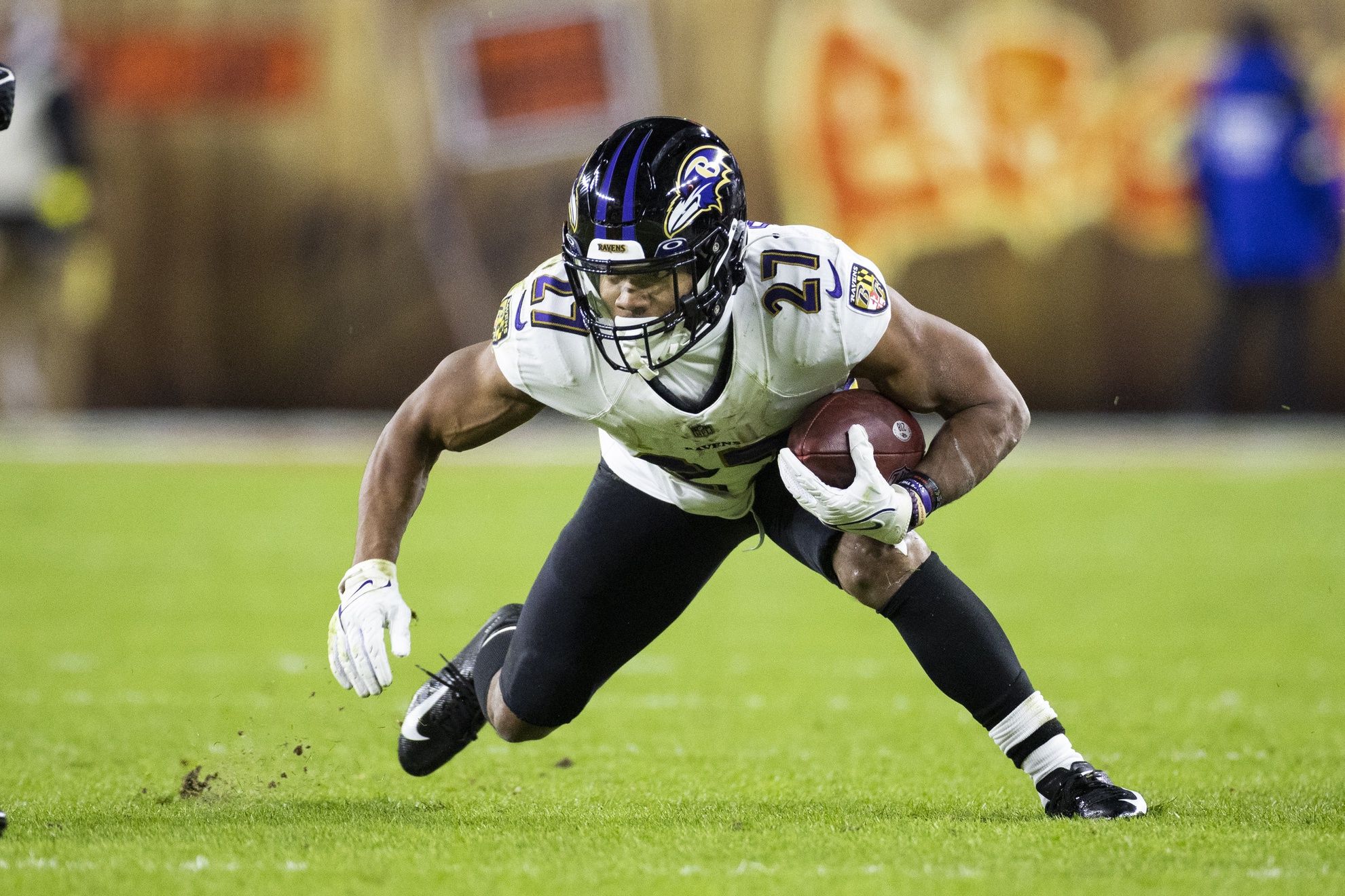 J.K. Dobbins (27) runs the ball against the Cleveland Browns during the second quarter at FirstEnergy Stadium.