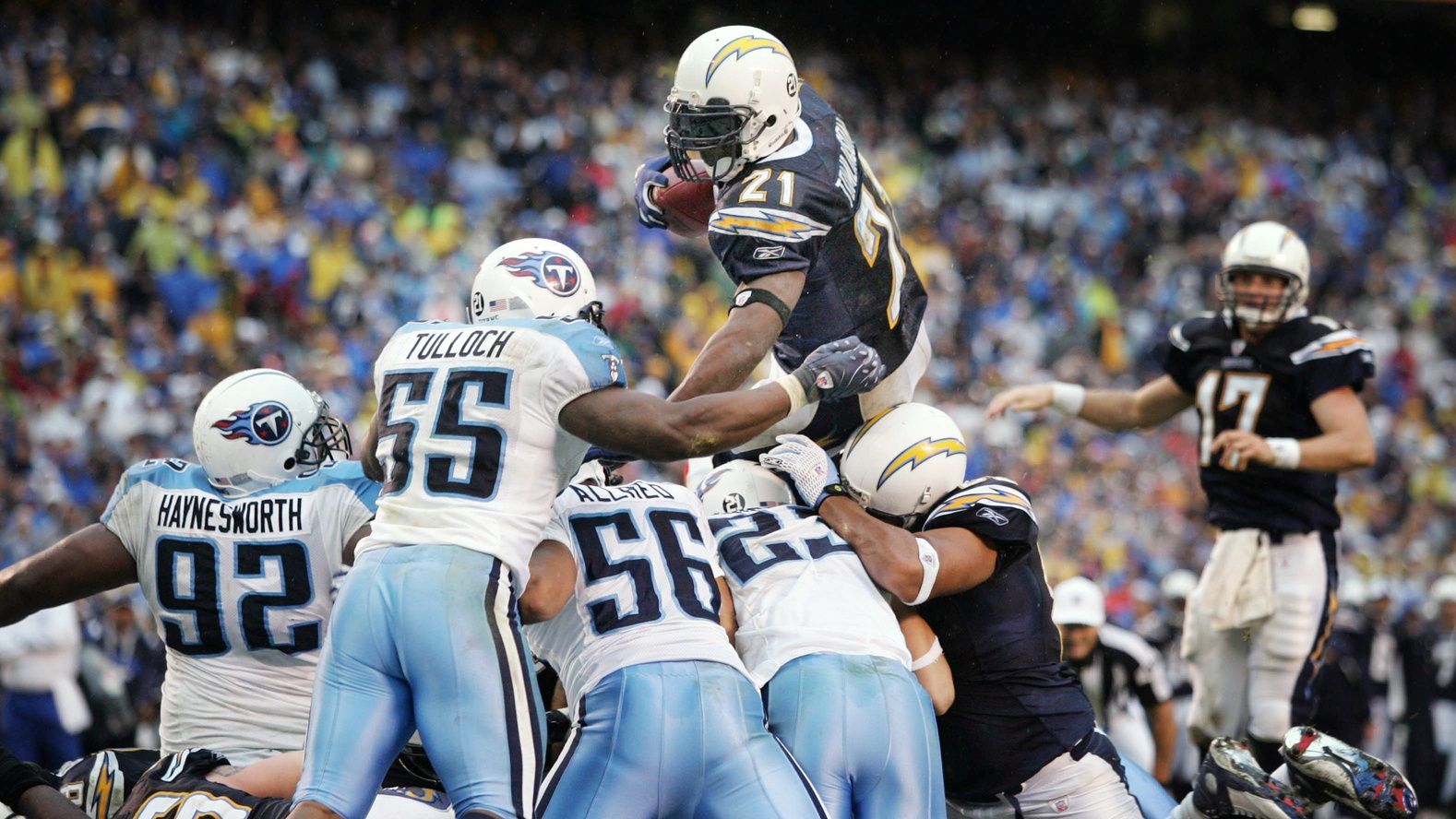 San Diego Chargers running back LaDainian Tomlinson (21) dives over the Tennessee Titans defense to score a touchdown in the fourth quarter to pull ahead 17 to 6 during the AFC Wild Card game at Qualcomm Stadium in San Diego Jan. 6, 2008.