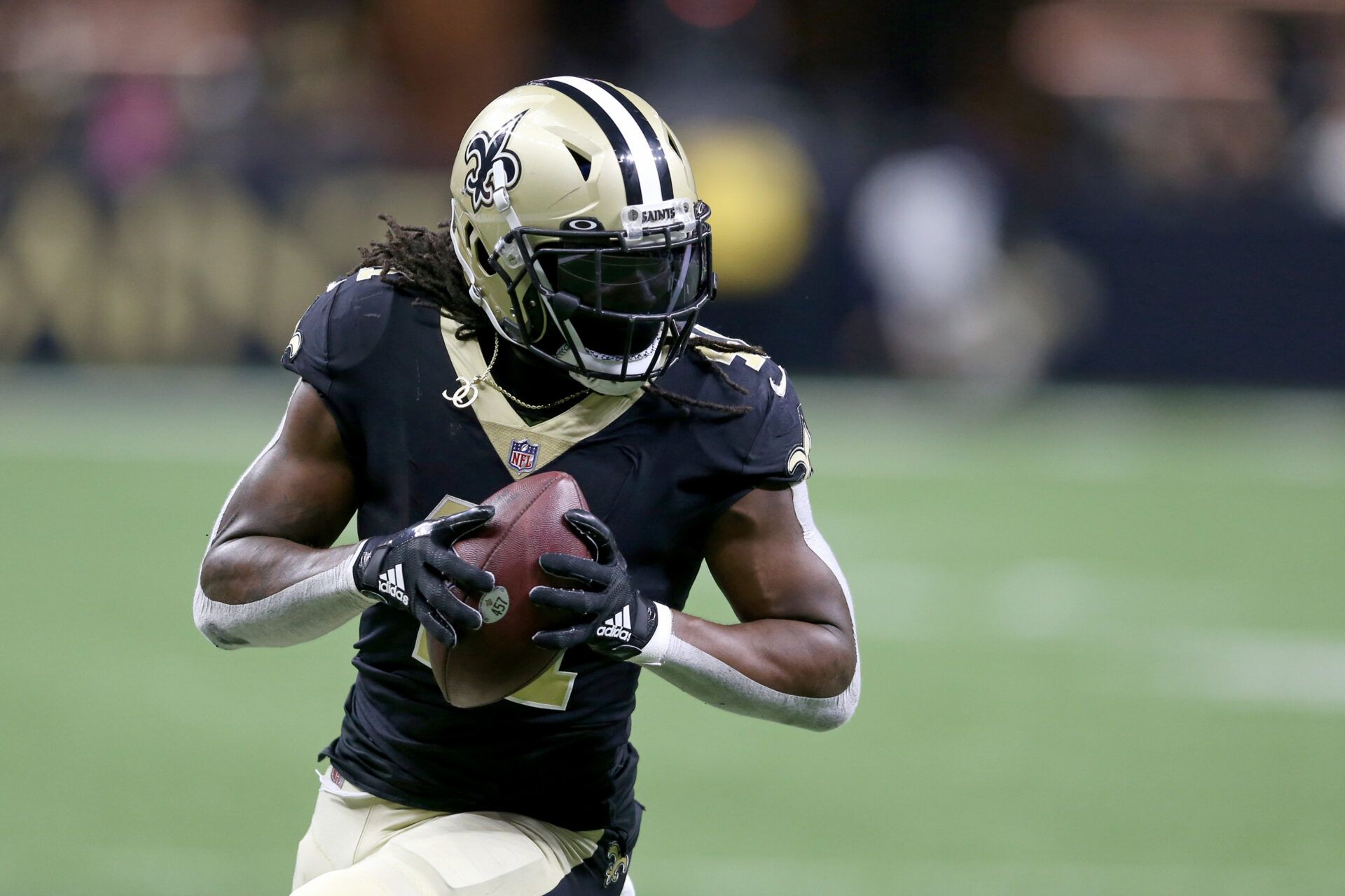 New Orleans Saints running back Alvin Kamara (41) runs after a catch in the second half against the Carolina Panthers at the Caesars Superdome. The Saints won, 18-10.