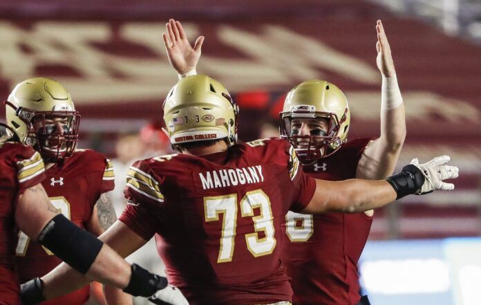 Boston College Eagles quarterback Dennis Grosel (6) celebrates a touchdown pass with offensive lineman Christian Mahogany (73) against the Louisville Cardinals during the second half at Alumni Stadium.