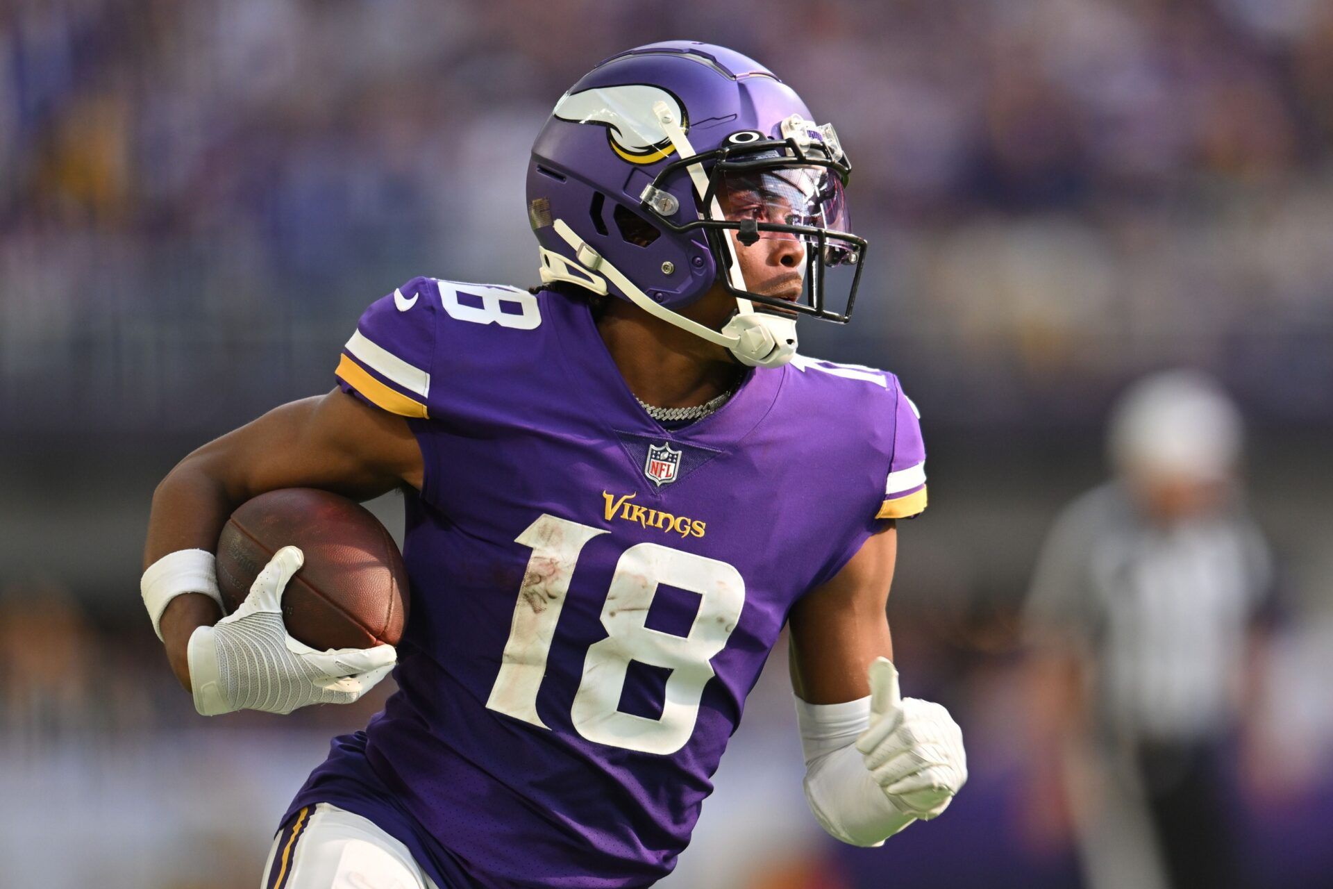 Justin Jefferson (18) in action against the Green Bay Packers at U.S. Bank Stadium.