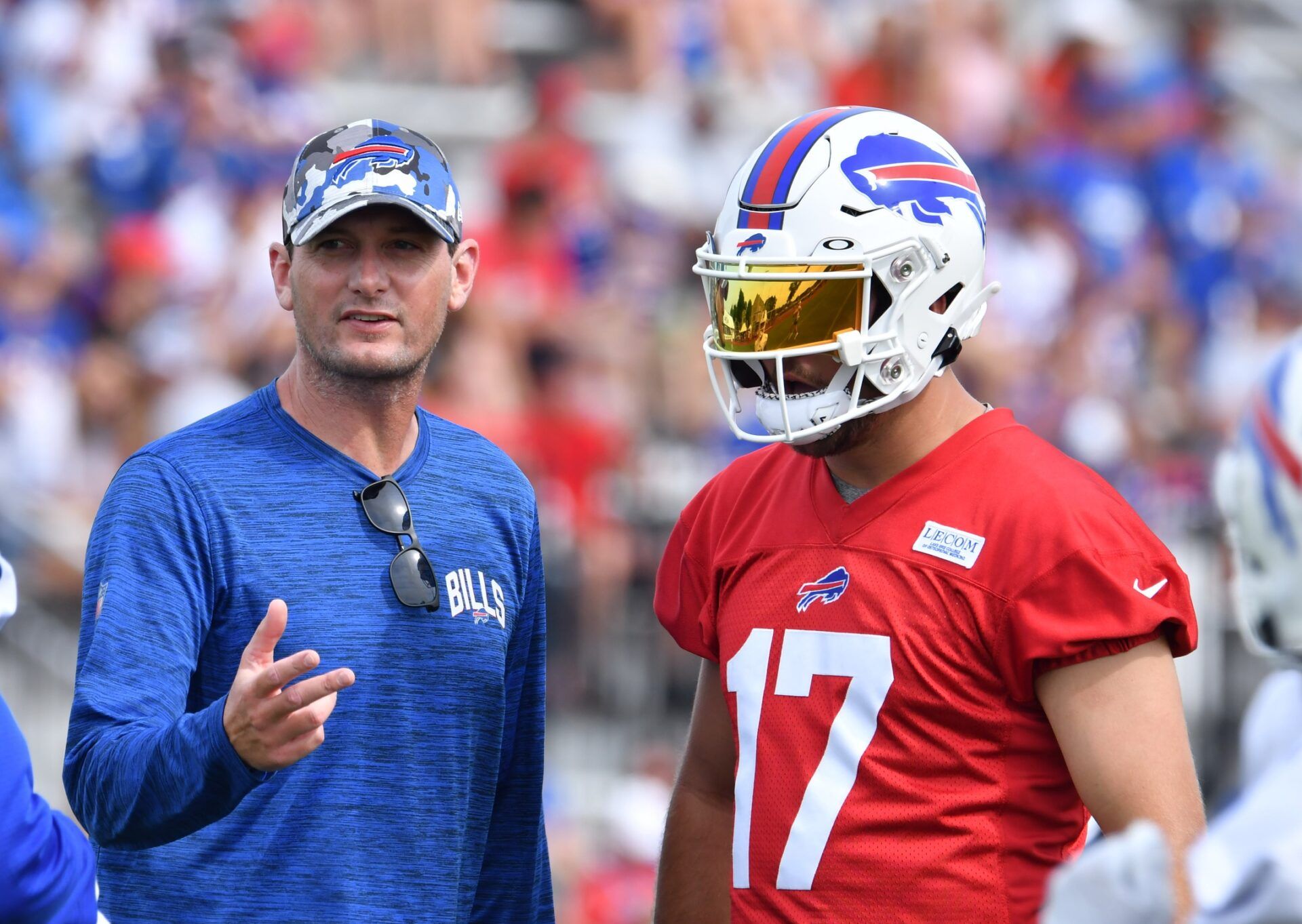 Buffalo Bills offensive coordinator Ken Dorsey talks with quarterback Josh Allen (17) during training camp at St. John Fisher University.