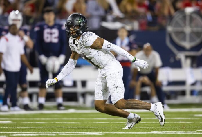 Christian Gonzalez works upfield against the Arizona Wildcats.