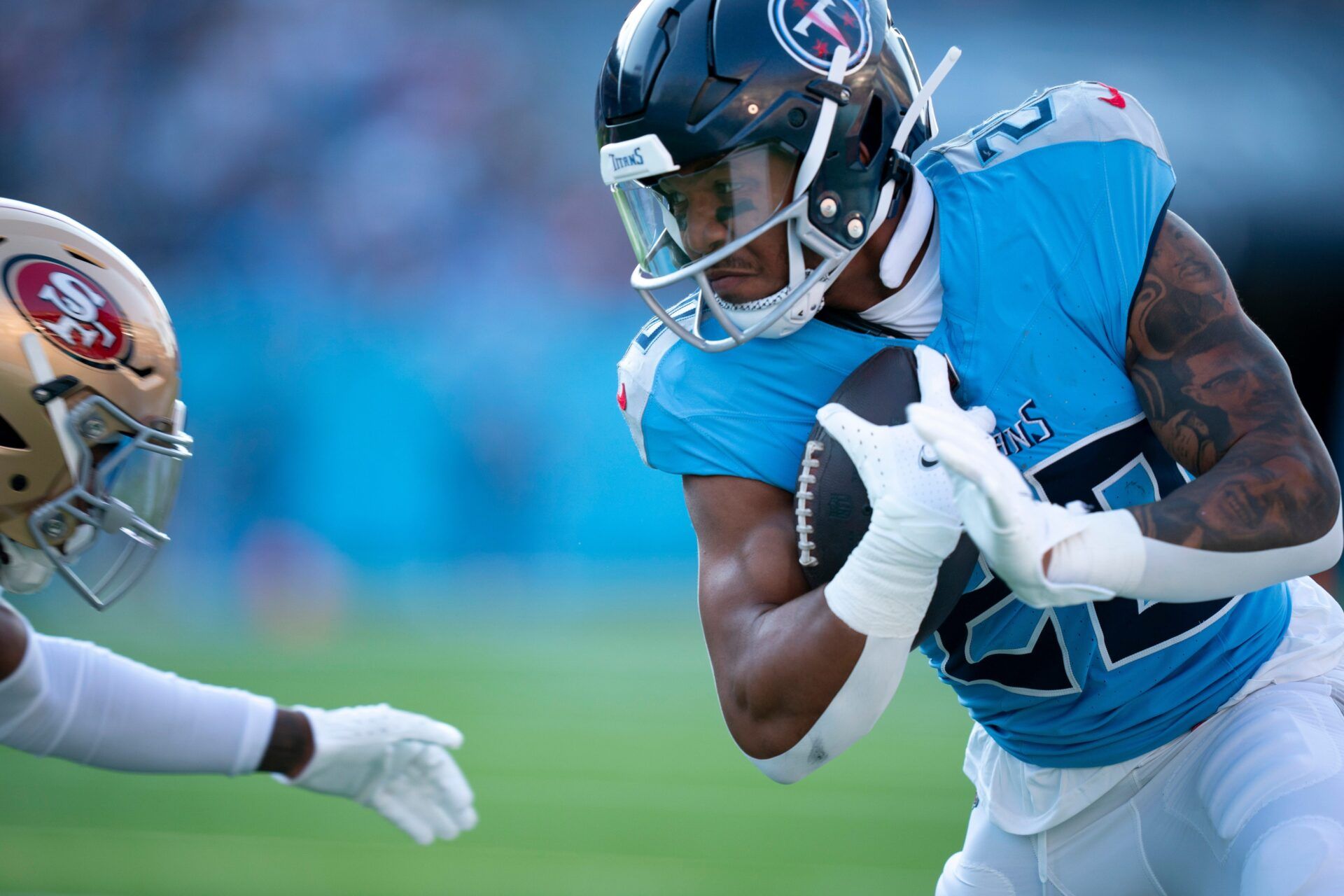 Tennessee Titans running back Tony Pollard (20) runs after a catch during their first preseason game of the 2024-25 season at Nissan Stadium Saturday, Aug. 10, 2024.