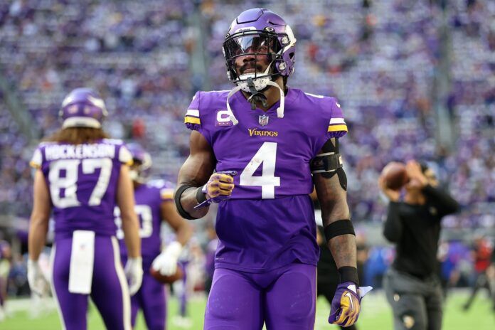 Dalvin Cook looks on during warmups before a facing the Giants.