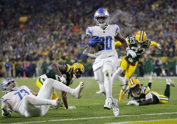 Jamaal Williams rushes for a touchdown against the Packers.