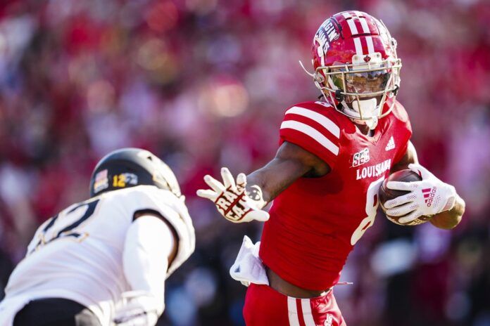 Michael Jefferson attempts to stiff arm a defender in the open field.