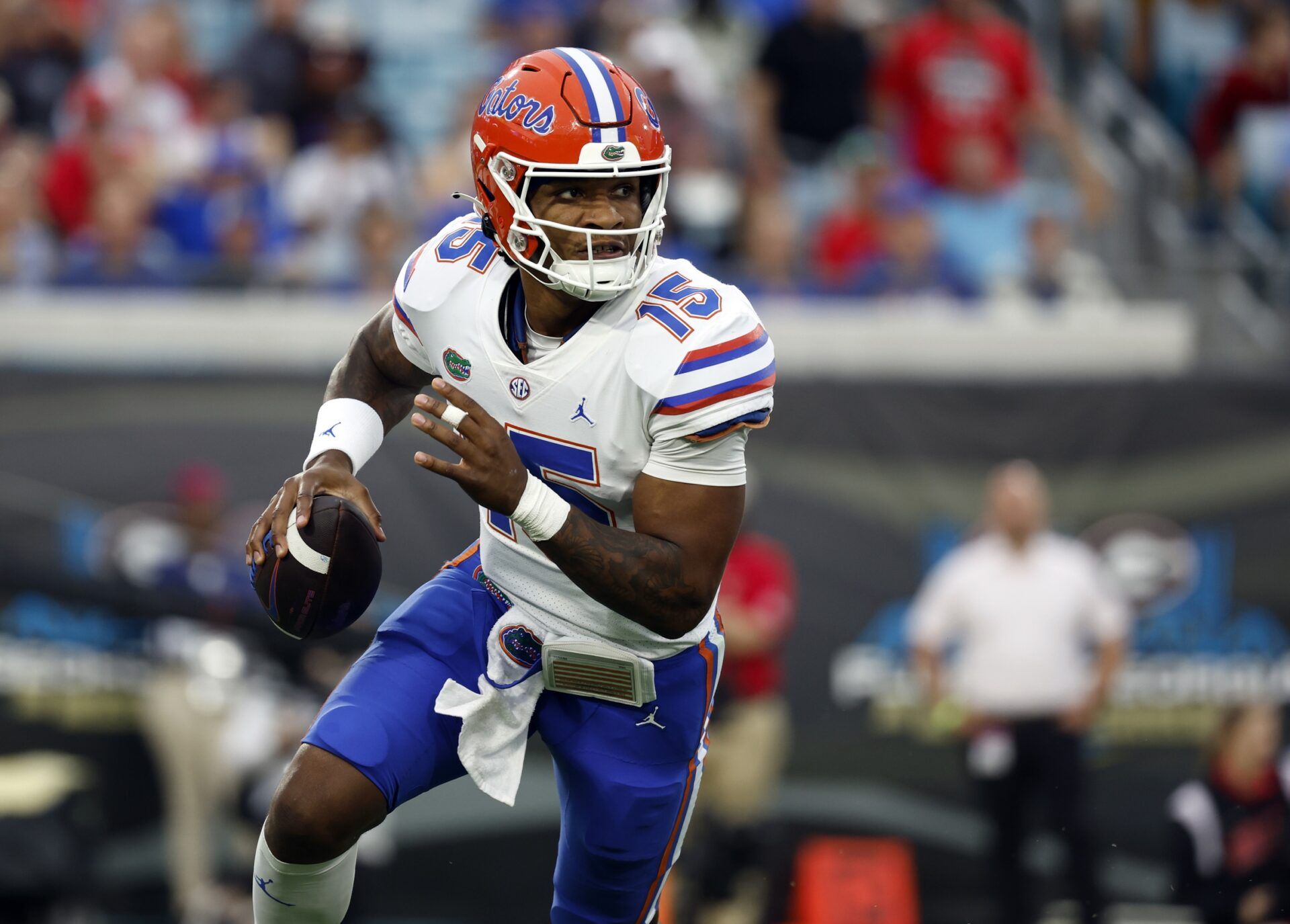 Florida Gators quarterback Anthony Richardson (15) runs out of the pocket against the Georgia Bulldogs during the second quarter.