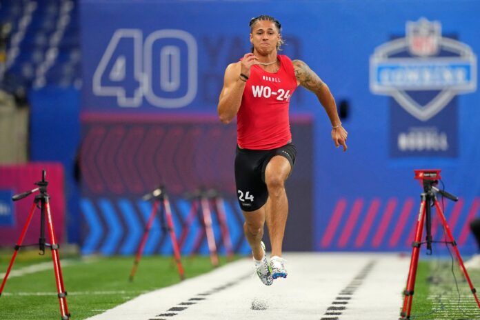 Andrei Iosivas participates in the 40-yard dash at Lucas Oil Stadium.