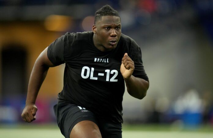 Utah Utes guard Braeden Daniels runs through drills at the NFL Scouting Combine.