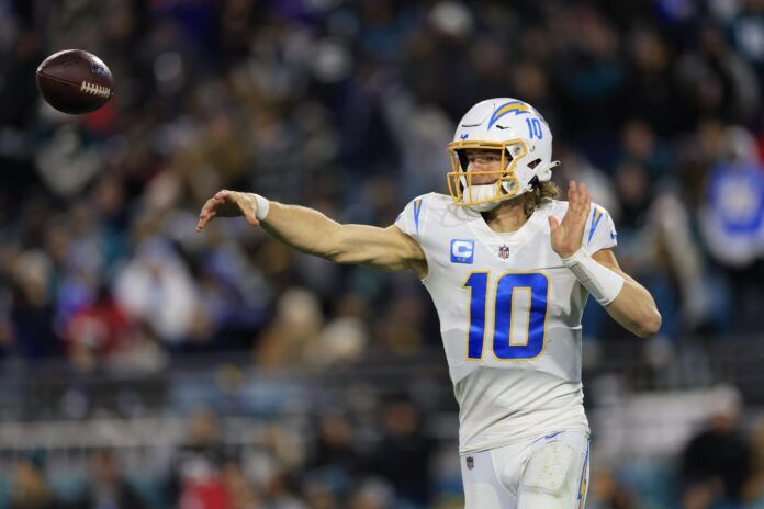 Los Angeles Chargers quarterback Justin Herbert (10) gas his pass batted during the second quarter of an NFL first round playoff football matchup Saturday, Jan. 14, 2023 at TIAA Bank Field in Jacksonville, Fla.