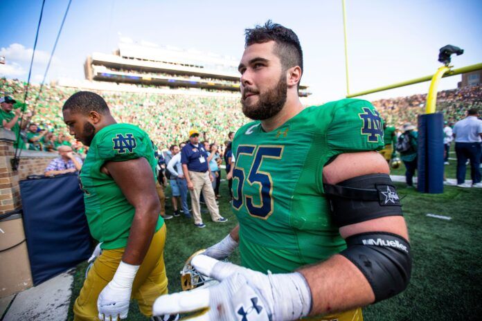 Notre Dame center Jarrett Patterson (55) walks off the field.