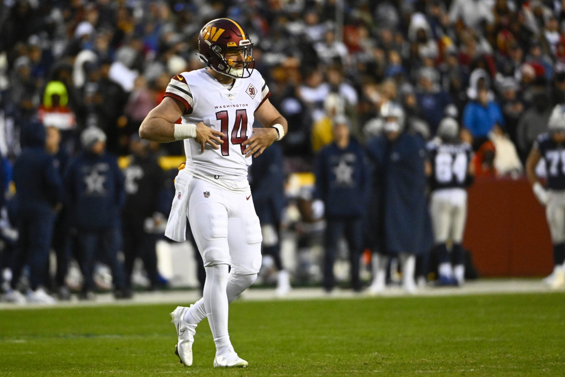 Sam Howell on the field against the Dallas Cowboys during the first half at FedExField.