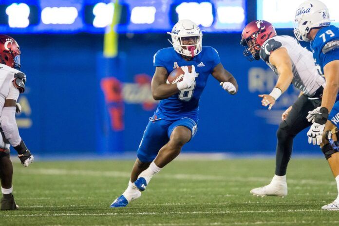 Deneric Prince runs the ball during the third quarter against the Cincinnati Bearcats.