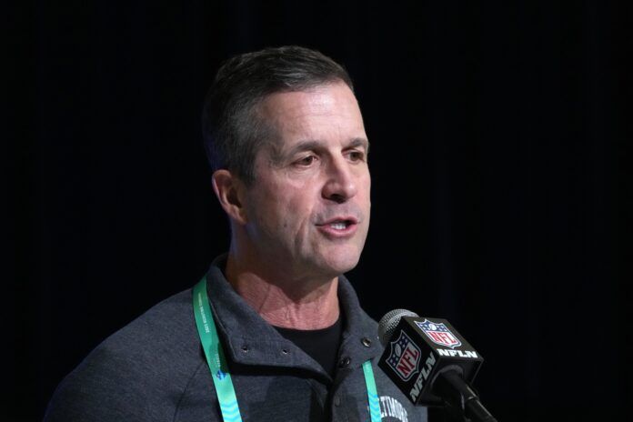 Baltimore Ravens head coach John Harbaugh speaks at the NFL Combine.