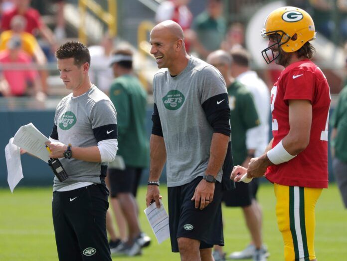 Jets offensive coordinator Mike LaFleur, left, head coach Robert Saleh and Packers quarterback Aaron Rodgers participate in a joint training camp practice.