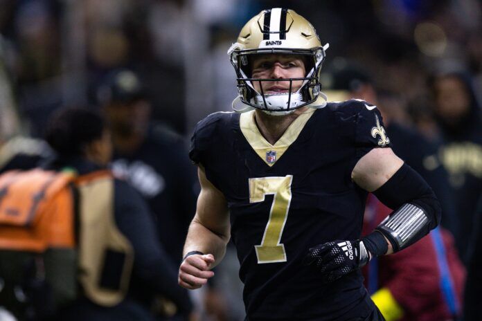 Taysom Hill runs to the locker room after the game against the Carolina Panthers.