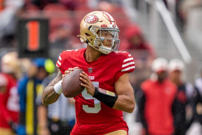 QB Trey Lance steps back to pass in the first quarter of a home game.