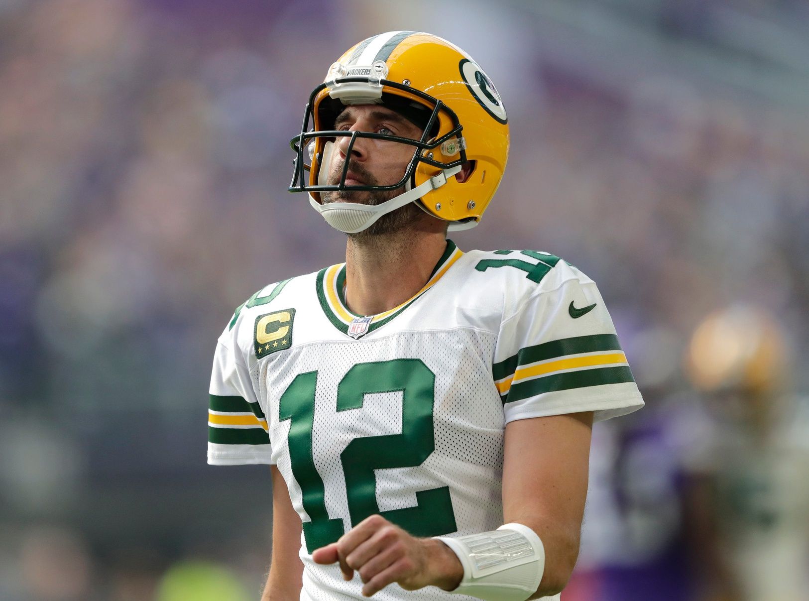 Green Bay Packers quarterback Aaron Rodgers (12) reacts in disappointment after a play.