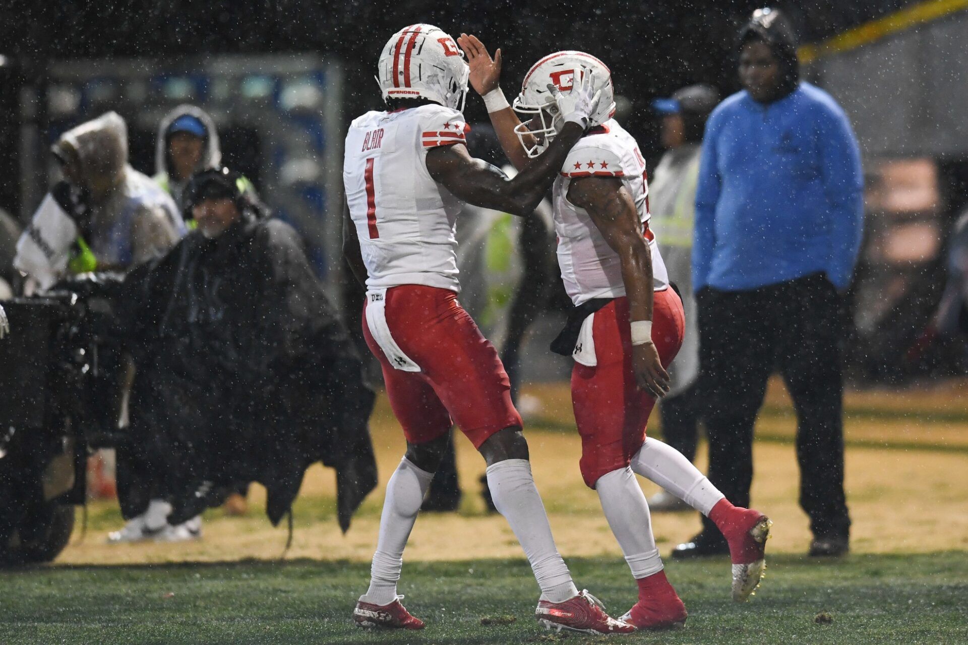 DC Defenders quarterback D'Eriq King (3) and wide receiver Chris Blair (1) celebrate after a touchdown.