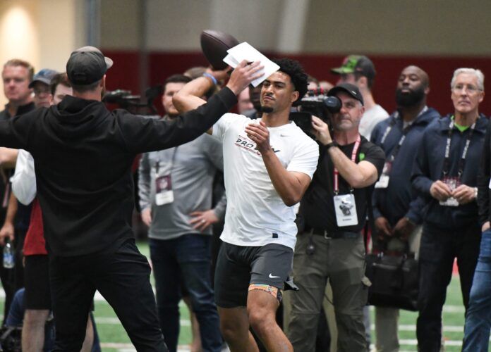 Bryce Young throws during Pro Day at Hank Crisp Indoor Practice Facility on the campus of the University of Alabama.