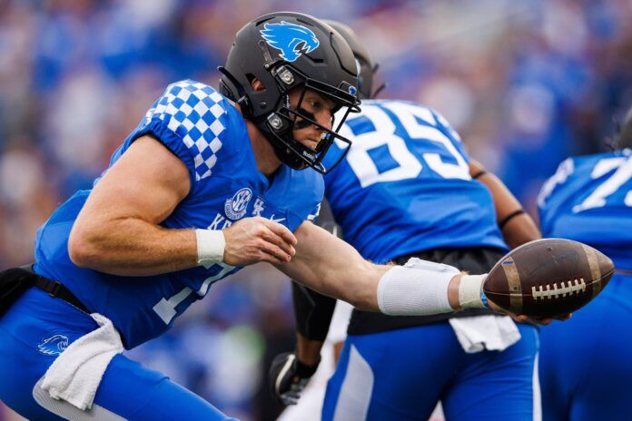 Will Levis fakes a handoff during the first quarter against the Louisville Cardinals.