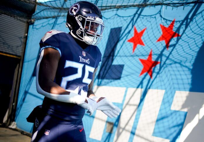 Hassan Haskins heads to the field before facing the Houston Texans.