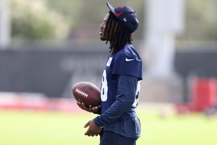 John Metchie III plays catch with a teammate at minicamp at NRG Stadium.