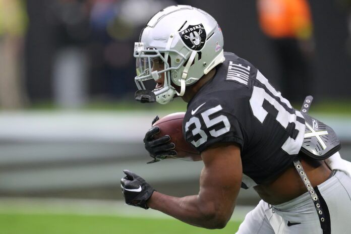 Las Vegas Raiders RB Zamir White (35) runs with the ball.