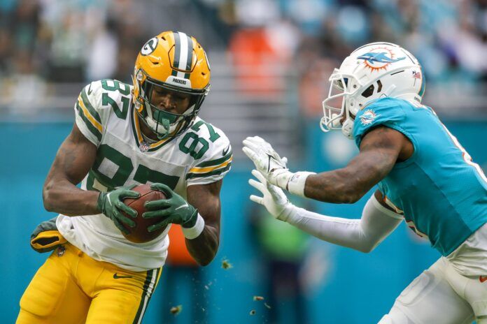 Green Bay Packers WR Romeo Doubs (87) runs with the ball against Miami.