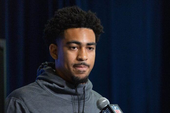 Bryce Young speaks to the press at the NFL Combine at Lucas Oil Stadium.