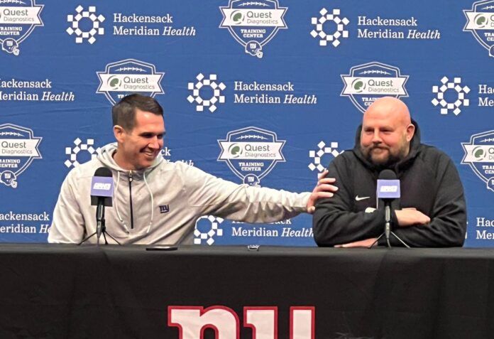 Giants general manager Joe Schoen jokes with head coach Brian Daboll during the Giants' end-of-season conference.