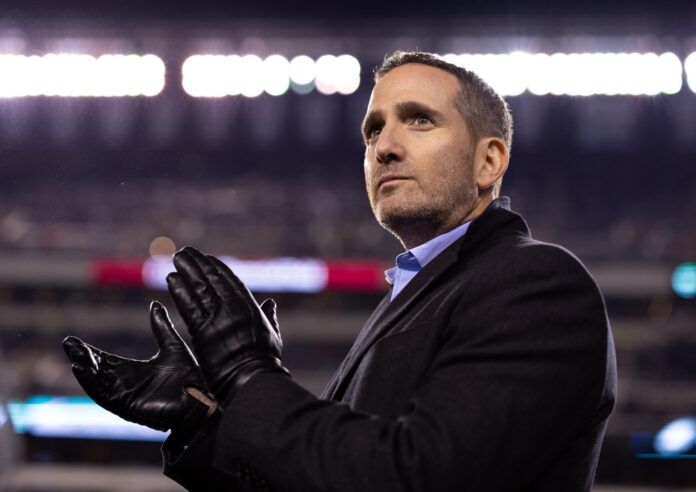 Philadelphia Eagles general manager Howie Roseman applauds at game.