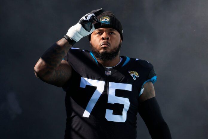 Jawaan Taylor takes to the field before a regular season NFL football matchup.