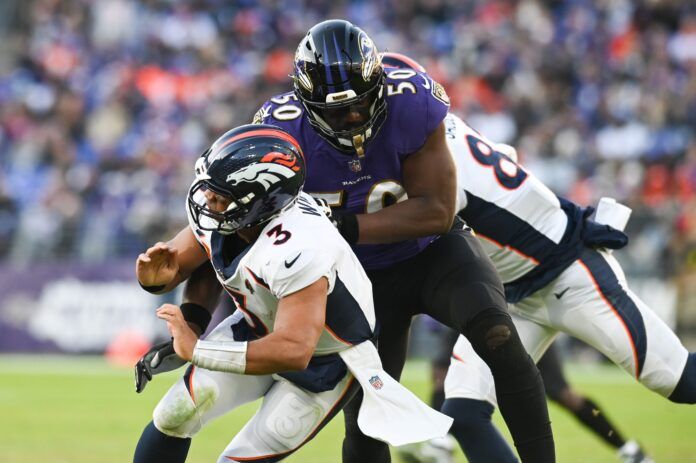 Baltimore Ravens linebacker Justin Houston (50) sacks Broncos QB Russell Wilson (3).