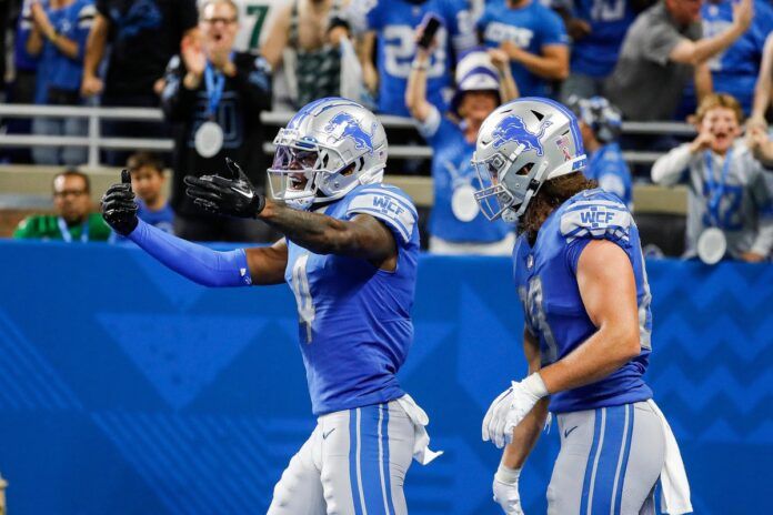 Detroit Lions WR DJ Chark (4) celebrates after scoring a touchdown.