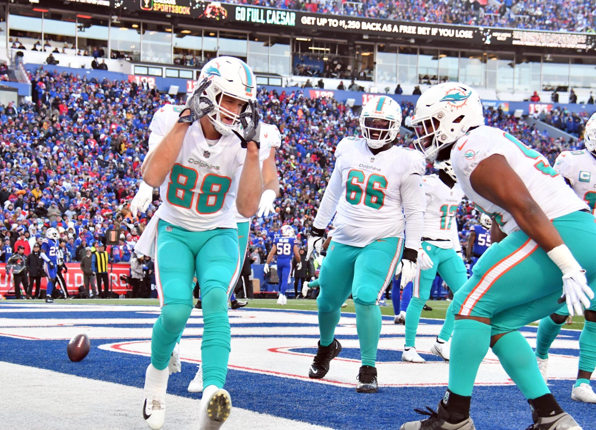 Mike Gesicki celebrates a touchdown reception against the Buffalo Bills.