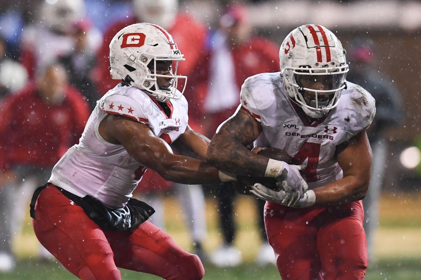 D'Eriq King hands the ball off to running back Abram Smith against the Vegas Vipers.