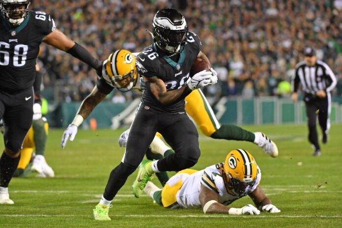 Philadelphia Eagles RB Miles Sanders (26) runs in for the score past Packers defenders.