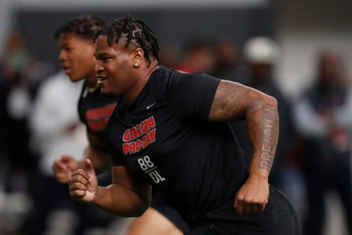 Jalen Carter and Georgia linebacker Nolan Smith run a drill during UGA Pro Day.